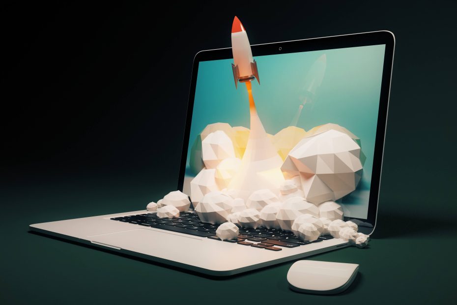 Rocket ship coming out of a laptop